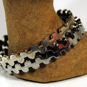 Two Matched Silvertone Wavy Design Metal Bracelets